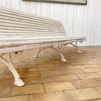 The early 20th century cast iron and wood garden bench