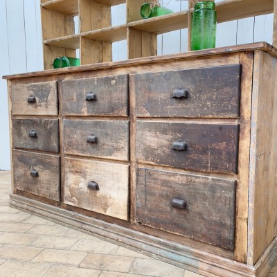 Former grocery cabinet with drawers circa 30