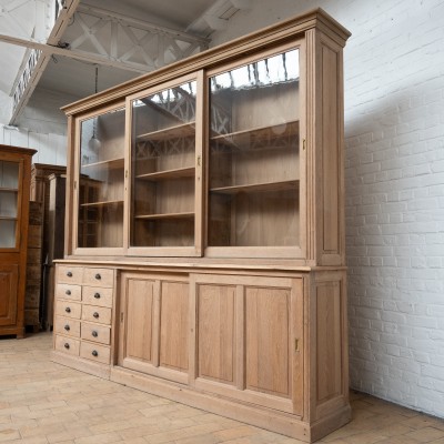 Large oak bookcase with sliding doors in 1930