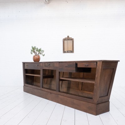 Large oak trapezoid counter, late 19th century