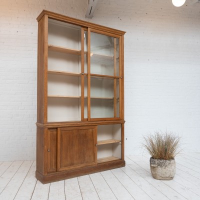 Oak display cabinet with sliding doors, 1930