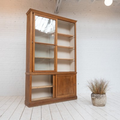 Oak display cabinet with sliding doors, 1930