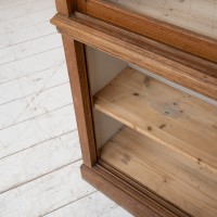 Oak display cabinet with sliding doors, 1930
