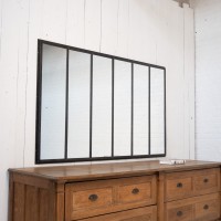 Miroir en métal riveté, début XXème