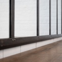 Miroir en métal riveté, début XXème