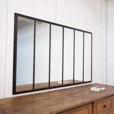 Miroir en métal riveté, début XXème