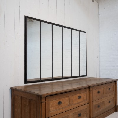 Miroir en métal riveté, début XXème