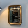 Mirror in golden stucco wood with gold leaf.