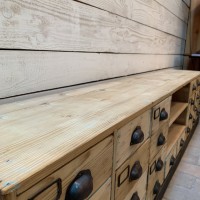 Low wooden cabinet with drawers