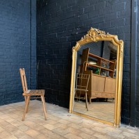 Large antique mirror in wood and gilded stucco